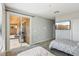Bright bedroom with twin beds and sliding glass door to the outside patio at 3903 Henny Ave, Las Vegas, NV 89141