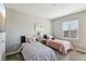 Comfortable bedroom with twin beds, a window, and a mounted TV at 3903 Henny Ave, Las Vegas, NV 89141