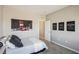 This cozy bedroom features a grey color palette and is filled with natural light at 3903 Henny Ave, Las Vegas, NV 89141