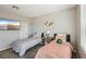 Bright bedroom with twin beds, a window and a mounted TV at 3903 Henny Ave, Las Vegas, NV 89141