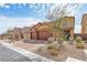 Charming two-story home with a three car garage, desert landscaping, and a beautiful tile roof at 3903 Henny Ave, Las Vegas, NV 89141