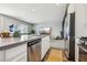Modern kitchen featuring stainless steel appliances and a view into the living room at 3903 Henny Ave, Las Vegas, NV 89141