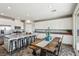 Bright kitchen with white cabinets, stainless appliances, and a spacious island at 3903 Henny Ave, Las Vegas, NV 89141