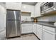 Bright kitchen featuring white cabinets, stainless steel appliances, and modern countertops at 3903 Henny Ave, Las Vegas, NV 89141
