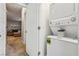 Convenient stacked washer and dryer setup near the living room at 3903 Henny Ave, Las Vegas, NV 89141