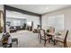 Open-concept living room with modern furnishings and dining area at 3903 Henny Ave, Las Vegas, NV 89141
