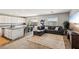 Open floorplan featuring a spacious living room with a kitchen and dining area at 3903 Henny Ave, Las Vegas, NV 89141