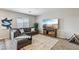 Comfortable living room featuring a large sectional sofa, entertainment center, and neutral decor for a cozy ambiance at 3903 Henny Ave, Las Vegas, NV 89141