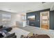 Spacious living room features contemporary design with large windows and a modern entertainment center at 3903 Henny Ave, Las Vegas, NV 89141