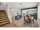 Open concept living room with a staircase, dining area, and view into the Gathering room at 3903 Henny Ave, Las Vegas, NV 89141