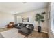Comfortable living area with modern sofa, stylish decor, and ample natural light at 3903 Henny Ave, Las Vegas, NV 89141