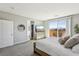 Bright main bedroom with walk-out balcony and a glimpse into the on-suite bath at 3903 Henny Ave, Las Vegas, NV 89141