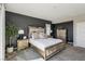 Elegant main bedroom featuring a decorative bed frame, stylish bedside tables, and neutral decor at 3903 Henny Ave, Las Vegas, NV 89141
