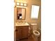 Bathroom features a single sink vanity, toilet, and window with blinds, providing natural light at 4120 E Cincinnati Ave, Las Vegas, NV 89104