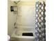 Bathroom features a shower-tub combination with white shower surround and a decorative shower curtain at 4120 E Cincinnati Ave, Las Vegas, NV 89104