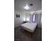 Bedroom with a simple bed and wood flooring at 4120 E Cincinnati Ave, Las Vegas, NV 89104