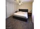 Bedroom showcasing modern bed frame, new laminate flooring, and closet with sliding doors at 4120 E Cincinnati Ave, Las Vegas, NV 89104