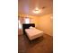 Bedroom with a black headboard and wood flooring at 4120 E Cincinnati Ave, Las Vegas, NV 89104