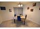Dining room featuring a small table and four blue chairs and tile floor at 4120 E Cincinnati Ave, Las Vegas, NV 89104