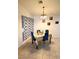 Dining room featuring a small table and four blue chairs and tile floor at 4120 E Cincinnati Ave, Las Vegas, NV 89104