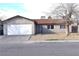 Traditional single-story home featuring low maintenance front yard and a two-car garage at 4120 E Cincinnati Ave, Las Vegas, NV 89104