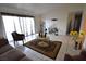 Cozy living room featuring a tile floor, a couch, chairs and decor at 4120 E Cincinnati Ave, Las Vegas, NV 89104