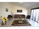 Cozy living room featuring a tile floor, a couch, chairs and decor at 4120 E Cincinnati Ave, Las Vegas, NV 89104
