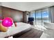 Bright bedroom featuring a large bed, sleek furniture, and floor-to-ceiling windows with breathtaking views at 4381 W Flamingo Rd # 1901, Las Vegas, NV 89103