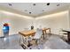 Bright office space with large wooden table, modern chairs and dark tile floors at 4381 W Flamingo Rd # 1901, Las Vegas, NV 89103