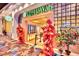 The entrance to the Tim Ho Wan restaurant is adorned with colorful decorations and greenery at 4381 W Flamingo Rd # 1901, Las Vegas, NV 89103