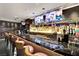 Upscale bar area with a dark marble countertop, plenty of seating, and a wide selection of beverages at 4381 W Flamingo Rd # 1903, Las Vegas, NV 89103