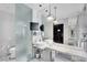 Elegant bathroom with marble countertops, double sinks, a glass shower, and modern lighting at 4381 W Flamingo Rd # 1903, Las Vegas, NV 89103