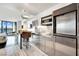 Sleek kitchen featuring stainless steel appliances, marble floors, and a breakfast bar with city views at 4381 W Flamingo Rd # 1903, Las Vegas, NV 89103