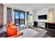 Inviting living room featuring modern furniture, a large window with city views, and stylish accents at 4381 W Flamingo Rd # 1903, Las Vegas, NV 89103