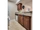 Galley kitchen with granite countertops and stainless steel sink at 5138 S Jones Blvd # 207, Las Vegas, NV 89118