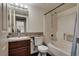 Bathroom featuring a granite countertop, sink, tub, and shower combo at 5166 S Jones Blvd # 202, Las Vegas, NV 89118
