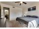 Bright bedroom with soft carpet, ceiling fan, and en suite bathroom at 5166 S Jones Blvd # 202, Las Vegas, NV 89118