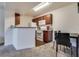 Well-lit kitchen area with bar top counter, complete with a full dining table at 5166 S Jones Blvd # 202, Las Vegas, NV 89118