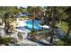 Overhead view of the refreshing community pool area, surrounded by palm trees and shady seating at 5166 S Jones Blvd # 202, Las Vegas, NV 89118