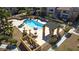 Aerial view of the pool with surrounding lounge area and pergola, beautifully landscaped with palm trees at 5166 S Jones Blvd # 202, Las Vegas, NV 89118