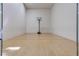 Empty racquetball court with hardwood floors, white walls, and a clear view of the net at 5166 S Jones Blvd # 202, Las Vegas, NV 89118