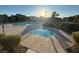 Beautiful community pool and hot tub surrounded by lush landscaping and palm trees, perfect for relaxation at 5183 Silica Chalk Ave, Las Vegas, NV 89115
