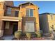 Tan two-story townhouse featuring a small front yard with desert landscaping at 5183 Silica Chalk Ave, Las Vegas, NV 89115