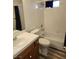 Bright bathroom with white tiled shower/tub combo and wood-look flooring at 520 Arrowhead Trl # 1411, Henderson, NV 89015