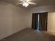 Spacious bedroom with carpet, neutral paint, and a large window providing natural light at 520 Arrowhead Trl # 1411, Henderson, NV 89015