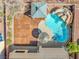 Aerial view of backyard featuring a pool with rock waterfall and a shaded gazebo area at 6136 Stanton Summit Dr, North Las Vegas, NV 89081