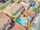 Aerial view showcasing a sparkling pool, gazebo, lush landscaping, and a well-maintained backyard oasis at 6136 Stanton Summit Dr, North Las Vegas, NV 89081