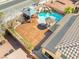 This aerial view showcases a backyard with a pool, gazebo, and stamped concrete at 6136 Stanton Summit Dr, North Las Vegas, NV 89081