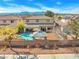 Expansive backyard featuring a luxurious pool area, charming gazebo, and beautiful landscaping at 6136 Stanton Summit Dr, North Las Vegas, NV 89081