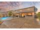 Spacious backyard featuring a covered patio, large pool and open area perfect for outdoor activities at 6136 Stanton Summit Dr, North Las Vegas, NV 89081